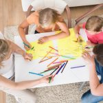 5412412_stock-photo-young-family-drawing-together-with-kids